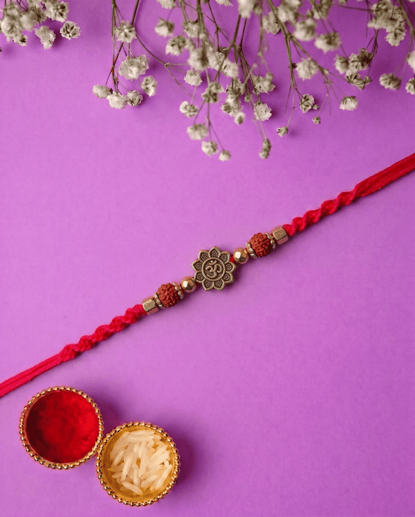 Spiritual Om Designer Rakhi with Traditional Red Thread Bhai Rakhi
